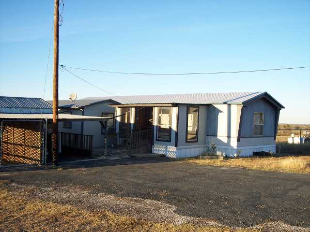11806 Schriber Road Buda, TX 78610 - Photo 1 of 1 a view of a house with a yard and garage