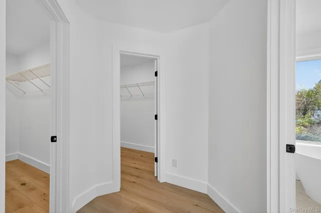 a view of a bathroom with wooden floor