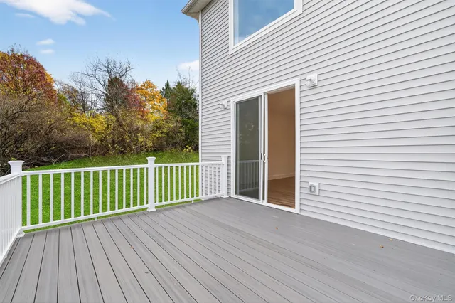 a view of house with backyard