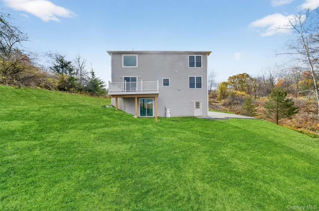 a view of a house with a back yard