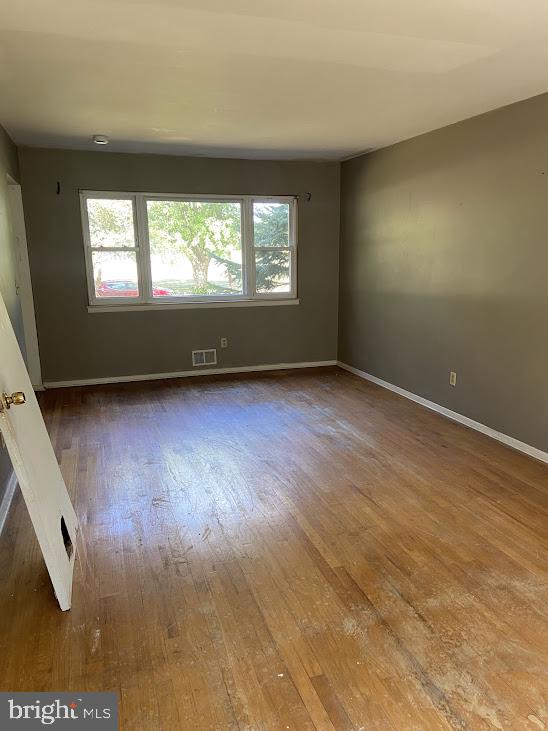 25 Fran Avenue Ewing, NJ 08618 - Photo 10 of 21 an empty room with wooden floor and windows