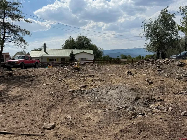 a view of outdoor space with playground and green space