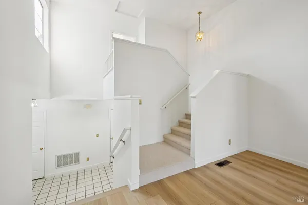 a view of entryway with wooden floor