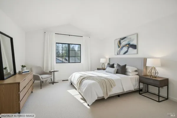 a bedroom with a bed and a couch