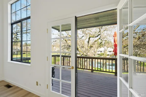 a view of a porch with wooden floor and outdoor space