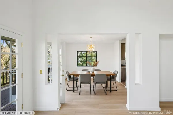 a view of a dining room with furniture and window