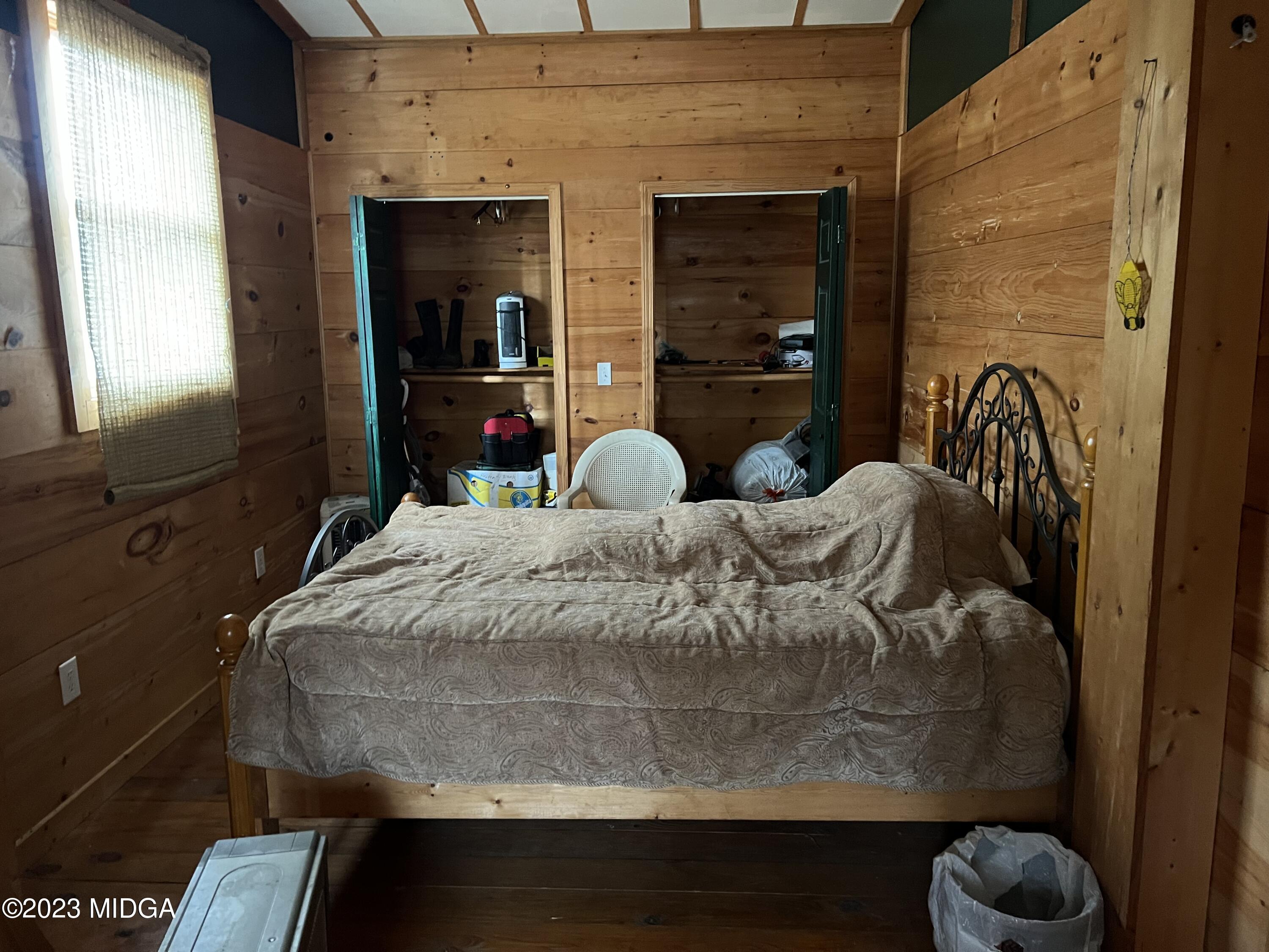 0 Forest Service Road Monticello, GA 31064 - Photo 24 of 32 a bedroom with a bed and a mirror
