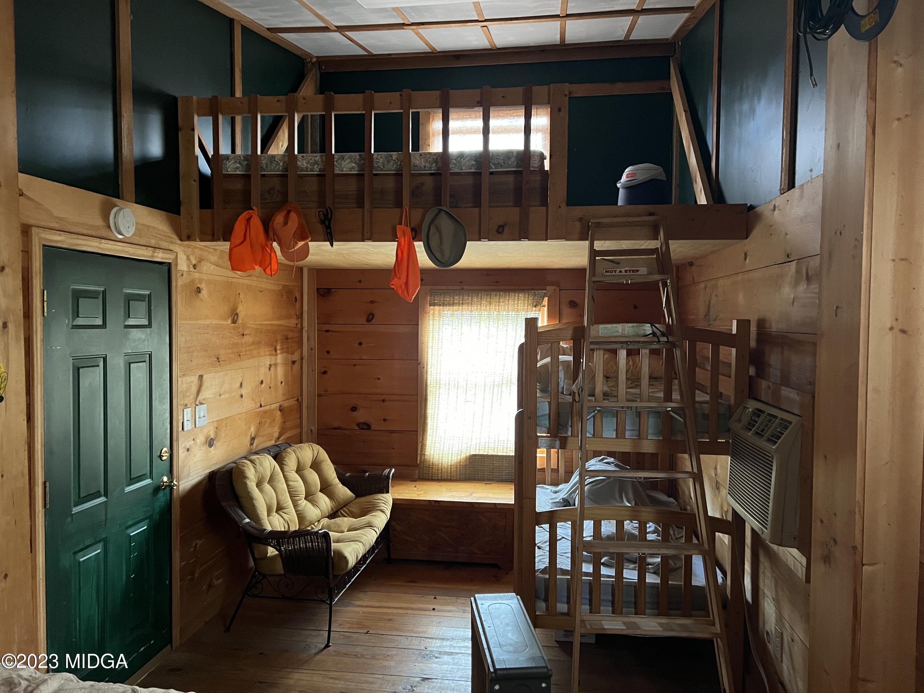0 Forest Service Road Monticello, GA 31064 - Photo 25 of 32 a balcony filled with furniture and wooden floor