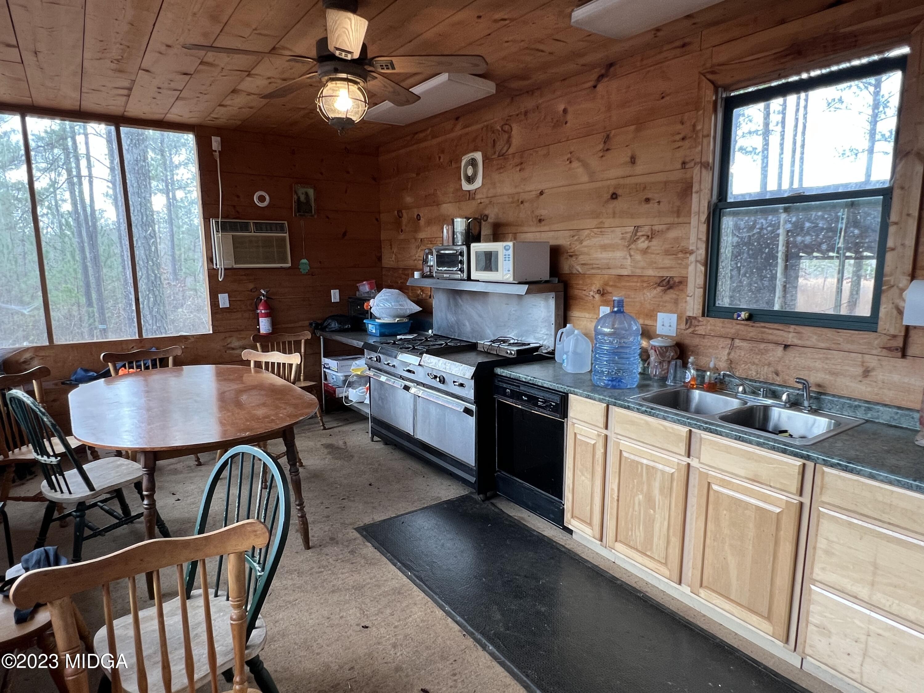 0 Forest Service Road Monticello, GA 31064 - Photo 27 of 32 a kitchen with granite countertop lots of counter top space and dining table