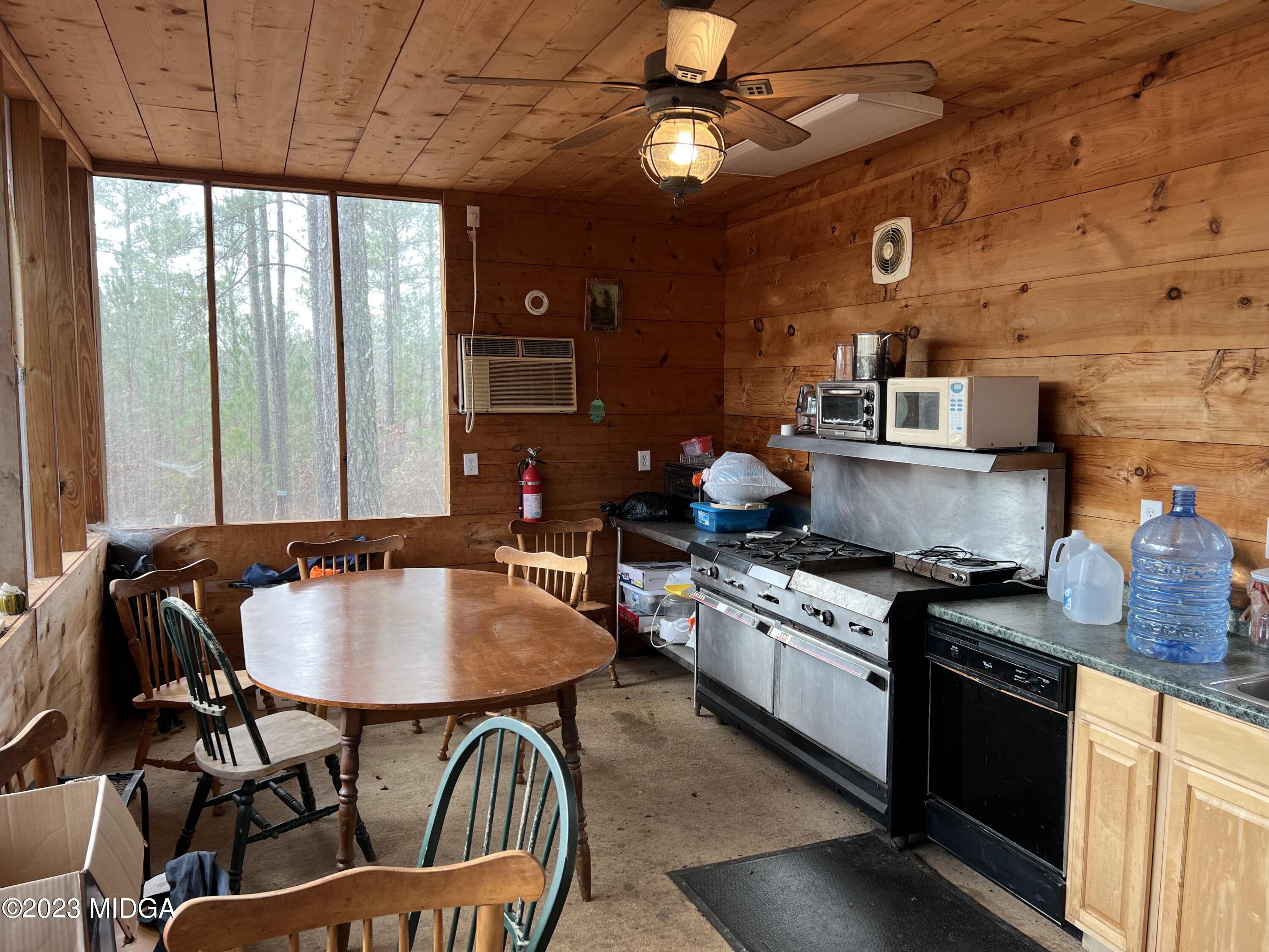 0 Forest Service Road Monticello, GA 31064 - Photo 29 of 32 a kitchen with sink a stove and chairs