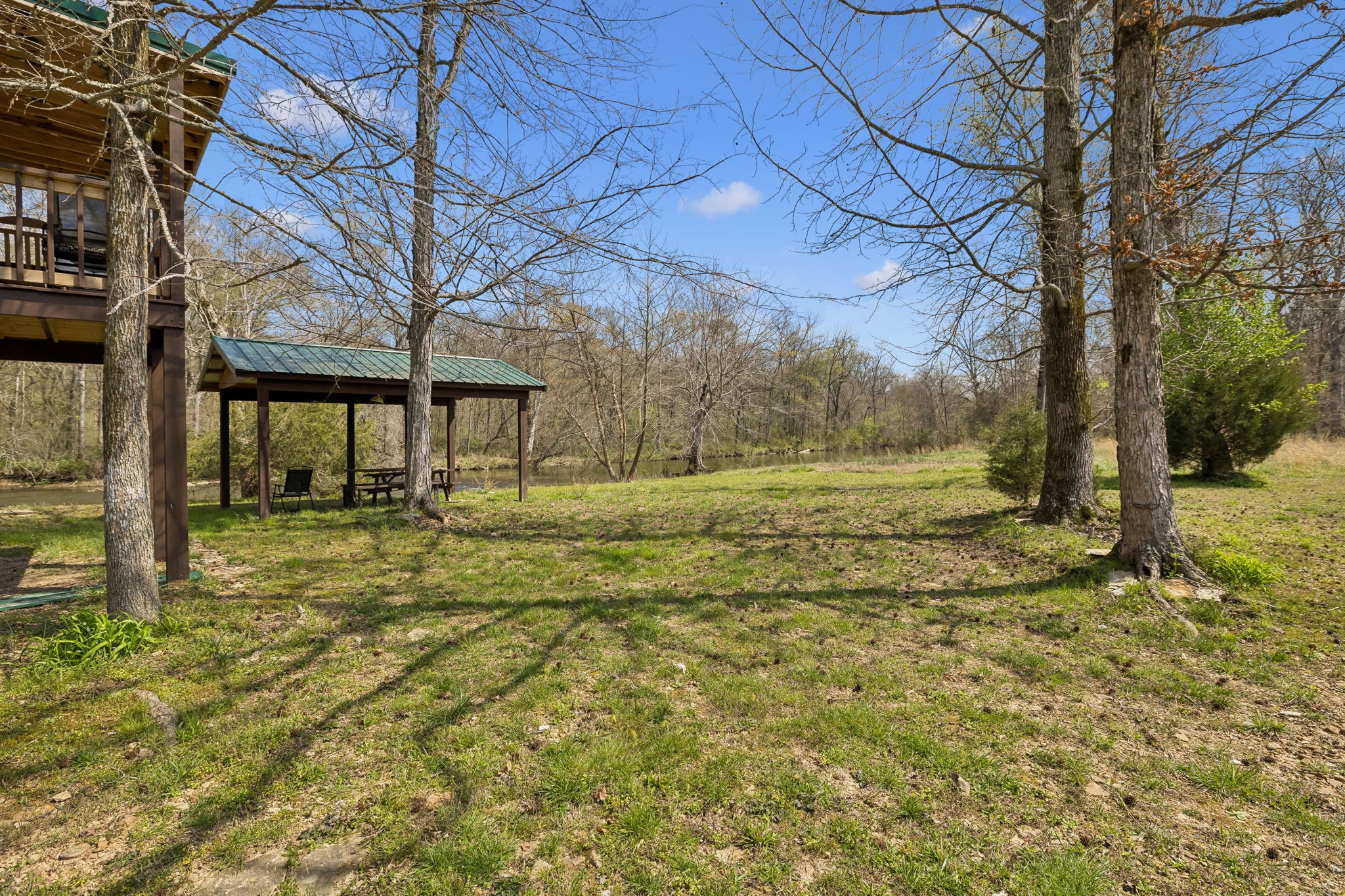 506 Tablerock Road Hohenwald, TN 38462 - Photo 30 of 64 a view of a yard with an trees