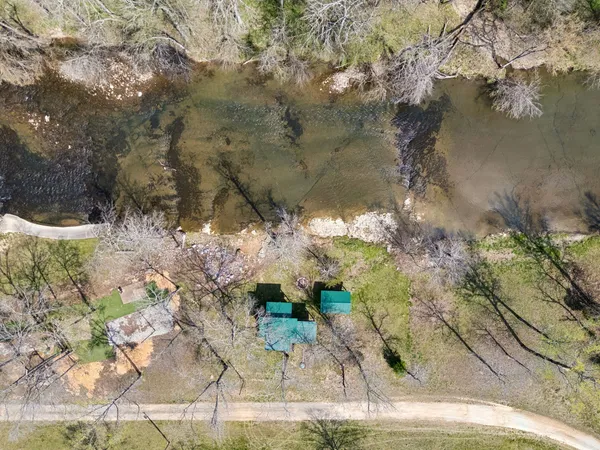 a view of swimming pool with a yard