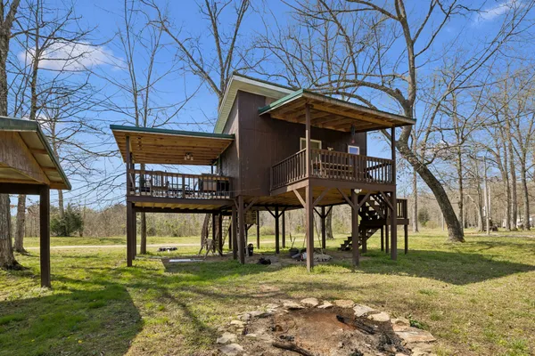 a view of backyard with large trees