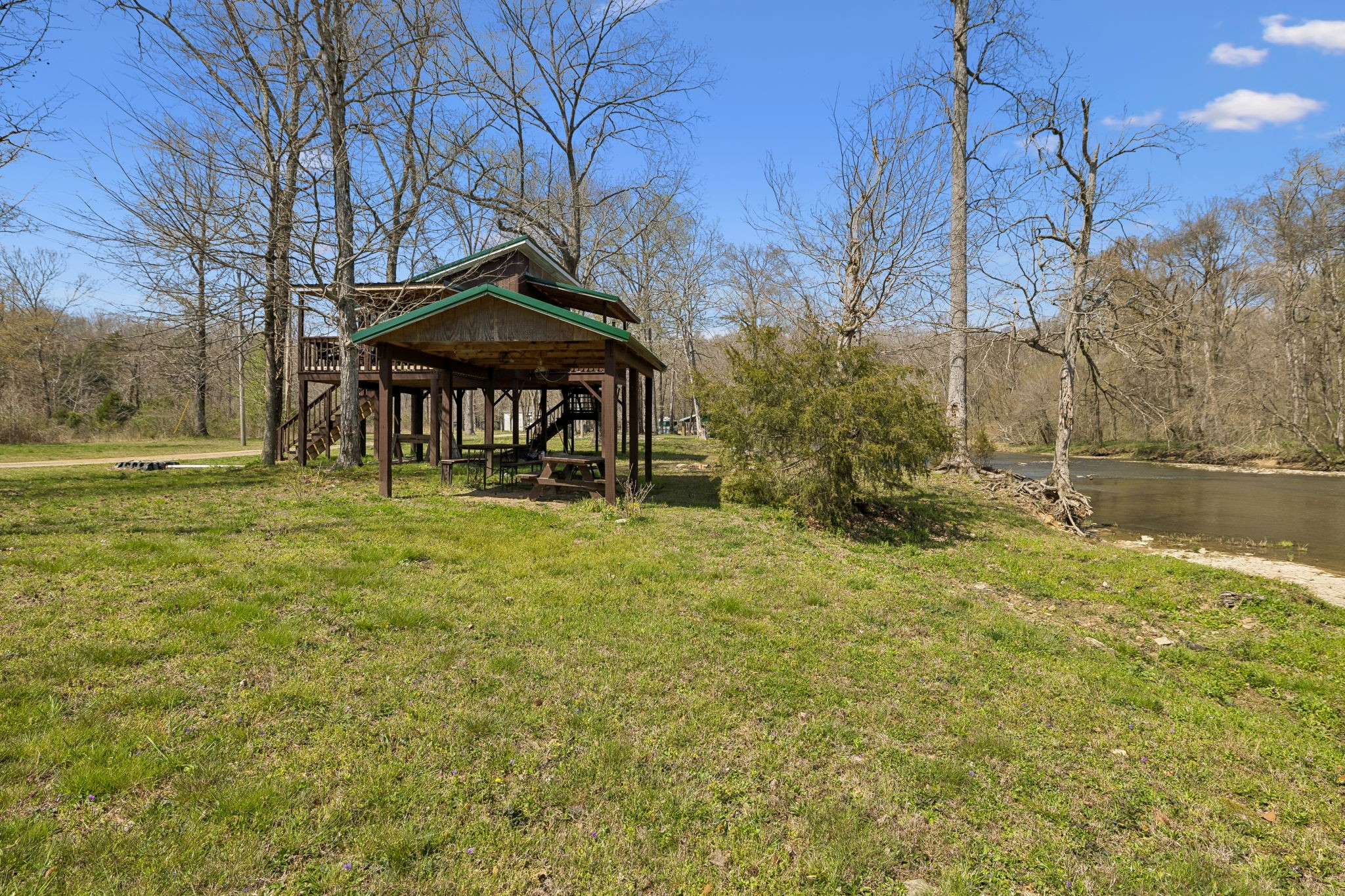 506 Tablerock Road Hohenwald, TN 38462 - Photo 10 of 64 a backyard of a house with table and chairs