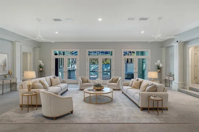 a view of a kitchen with white cabinets and sink