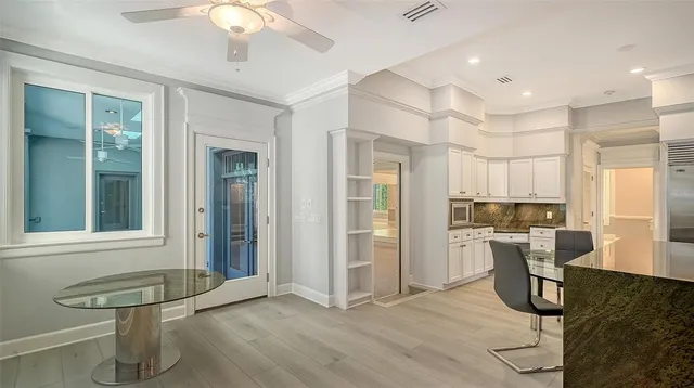 a bathroom with a granite countertop sink a bathtub and a shower