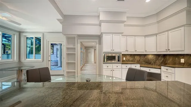a view of a room with wooden floor and balcony