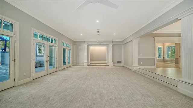 a living room with a couch and a lamp on the dresser