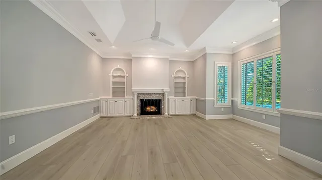 a view of a house with backyard porch and sitting area