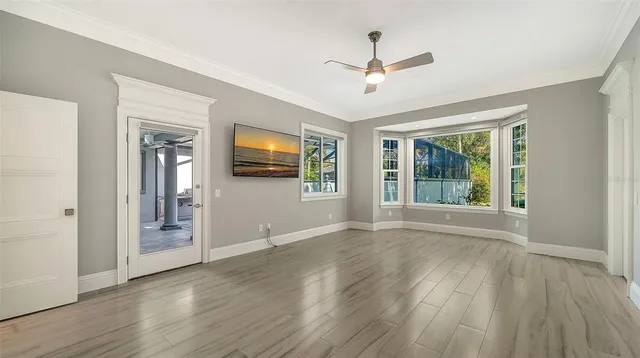 an aerial view of a house with a yard and outdoor seating