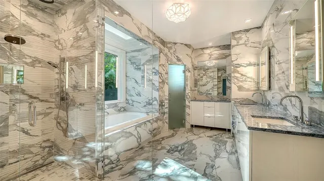 a front view of a house with yard and flowers