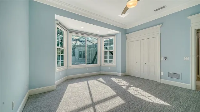 an aerial view of a houses with a lake view