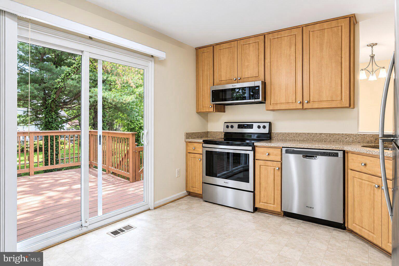 17303 Buehler Road Olney, MD 20832 - Photo 5 of 14 a kitchen with a stove a sink and a microwave