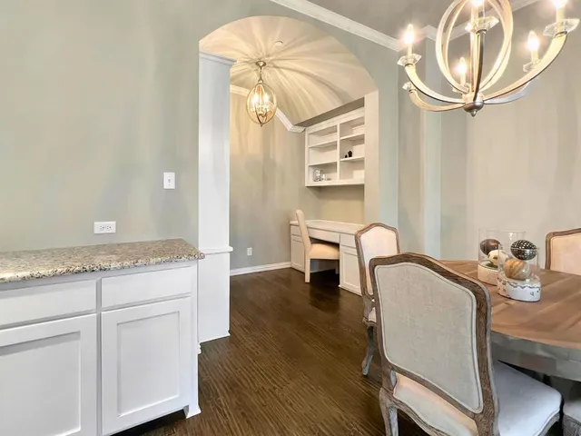 a bedroom with a bed and cabinets
