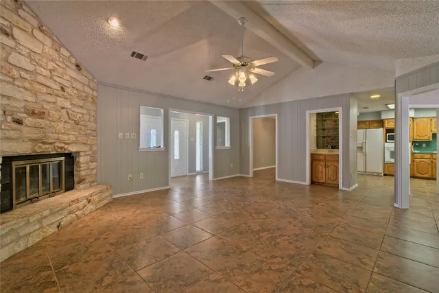 a view of an entryway with wooden floor and a livingroom
