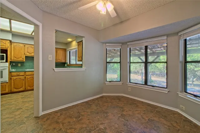 wooden floor in an empty room and a window