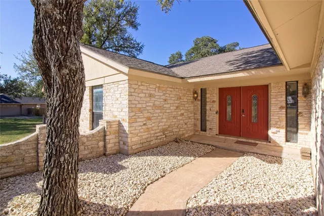 a view of a house with a yard and garage