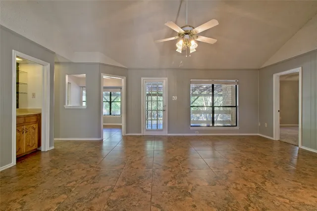 a view of an empty room with a fireplace
