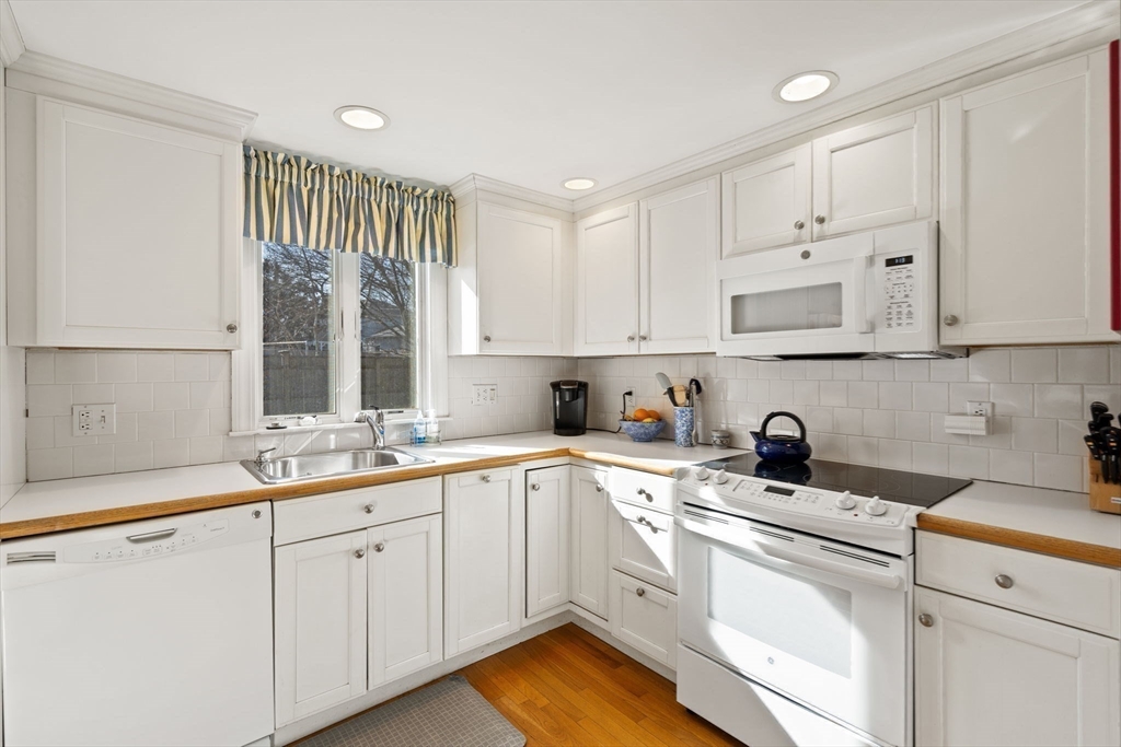 27 Cornell Road Marblehead, MA 01945 - Photo 13 of 34 a kitchen with a sink cabinets and window