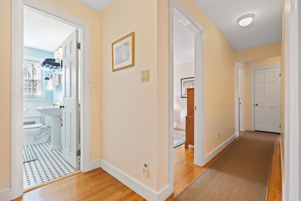 27 Cornell Road Marblehead, MA 01945 - Photo 15 of 34 a view of a hallway with bathroom and wooden floor
