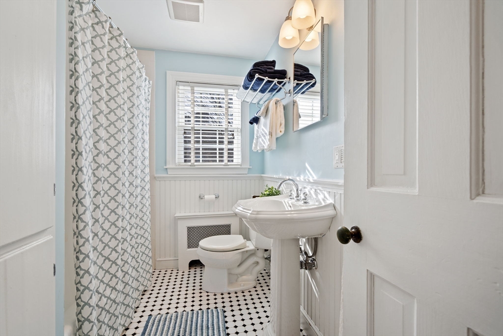 27 Cornell Road Marblehead, MA 01945 - Photo 16 of 34 a bathroom with a sink a toilet and a window
