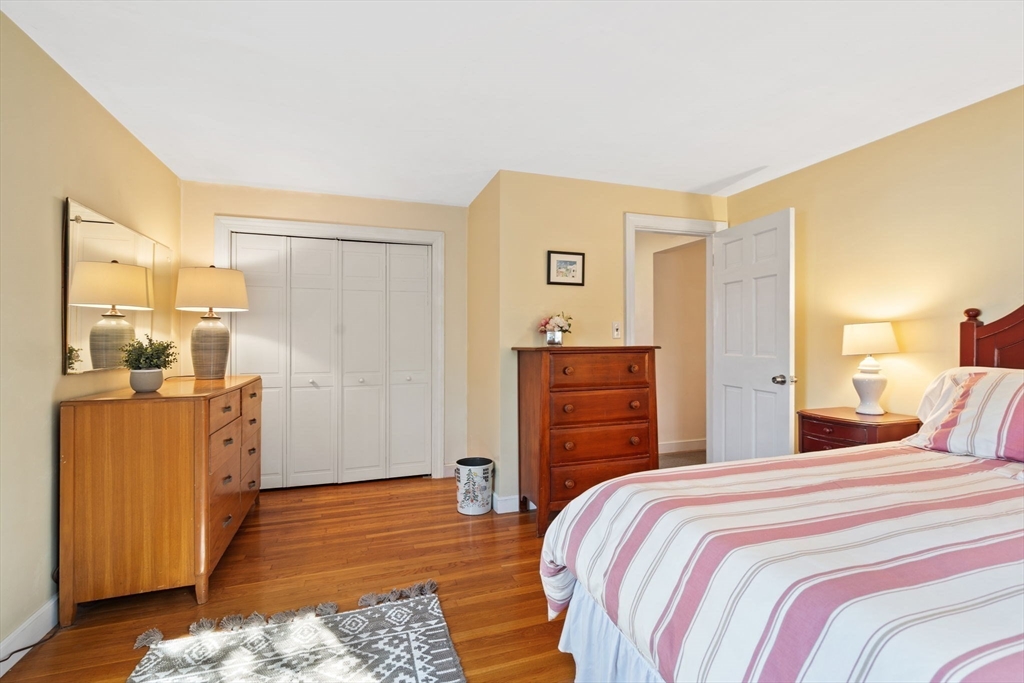 27 Cornell Road Marblehead, MA 01945 - Photo 22 of 34 a bedroom with a bed and wooden floor