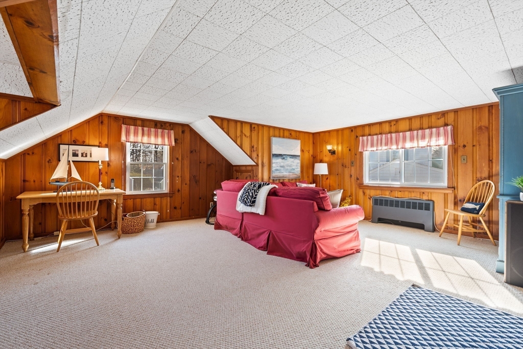 27 Cornell Road Marblehead, MA 01945 - Photo 25 of 34 a bedroom with a bed and glass door
