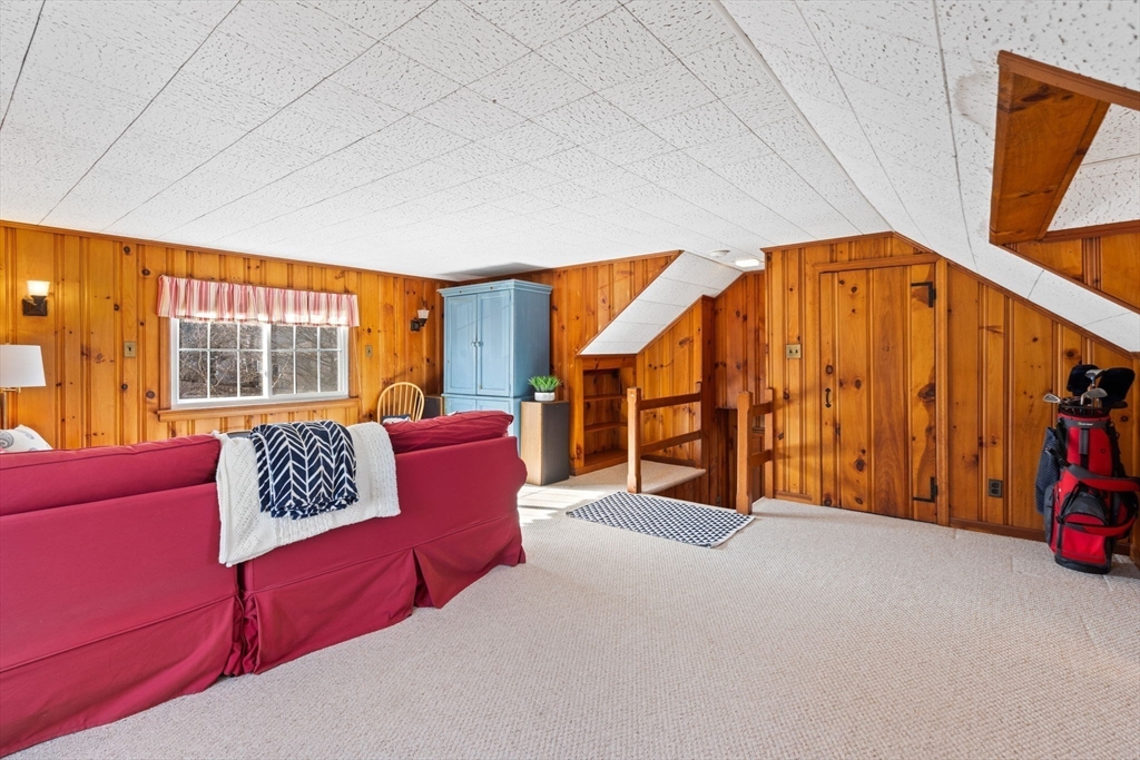 27 Cornell Road Marblehead, MA 01945 - Photo 26 of 34 a blue bed sitting in a room next to a window