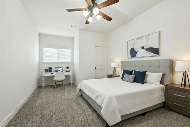 a bedroom with bed and window