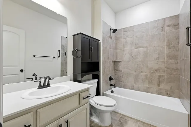 a bathroom with a sink a toilet and a bathtub