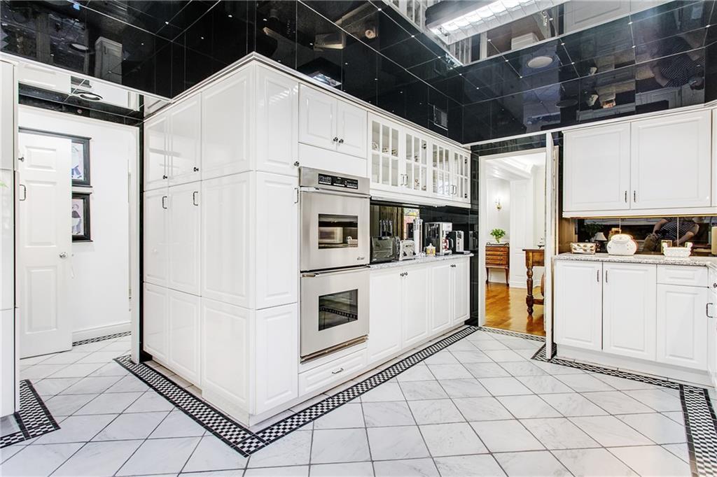 213 Hampton Road Pittsburgh, PA 15215 - Photo 11 of 21 a kitchen with white cabinets and white appliances