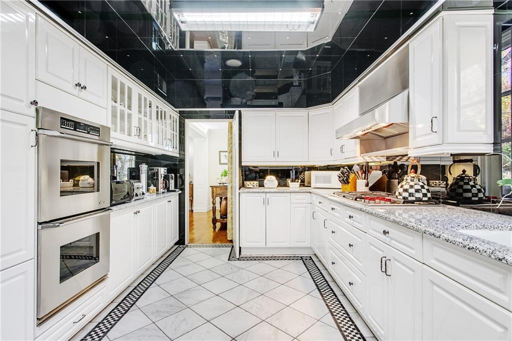 213 Hampton Road Pittsburgh, PA 15215 - Photo 13 of 21 a kitchen with stainless steel appliances granite countertop a refrigerator and a stove top oven
