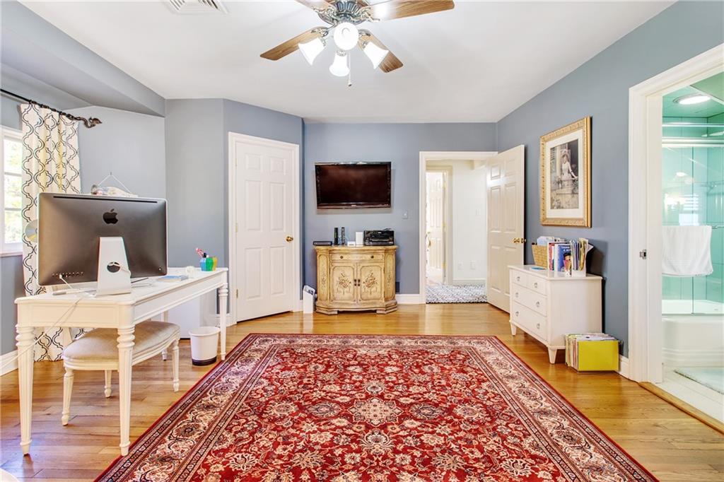 213 Hampton Road Pittsburgh, PA 15215 - Photo 15 of 21 a bedroom with a bed and a flat screen tv