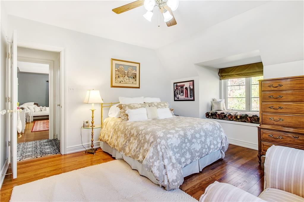 213 Hampton Road Pittsburgh, PA 15215 - Photo 16 of 21 a bedroom with a bed and dresser with mirror