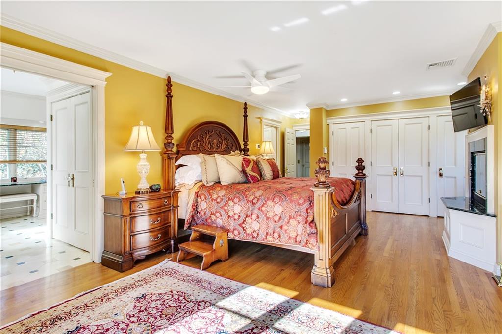 213 Hampton Road Pittsburgh, PA 15215 - Photo 17 of 21 a bedroom with a bed and wooden floor