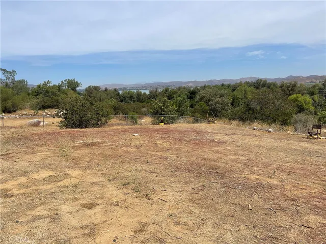 a view of a field with ocean view