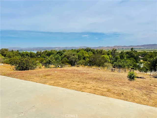 a view of a swimming pool with a lounge chair