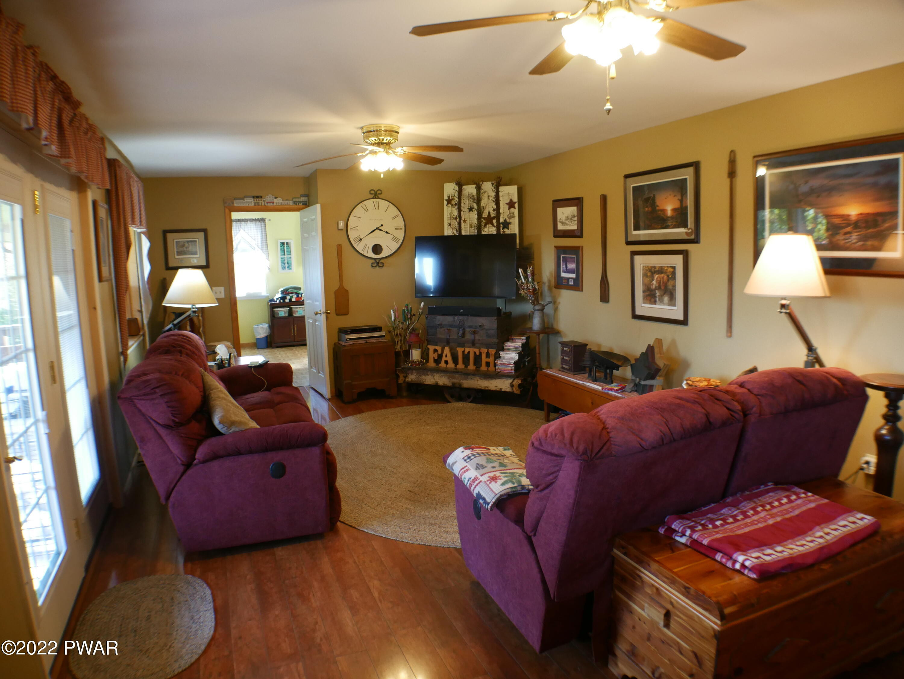 1259 Dougherty Road Meshoppen, PA 18630 - Photo 6 of 61 a living room with furniture and a lamp