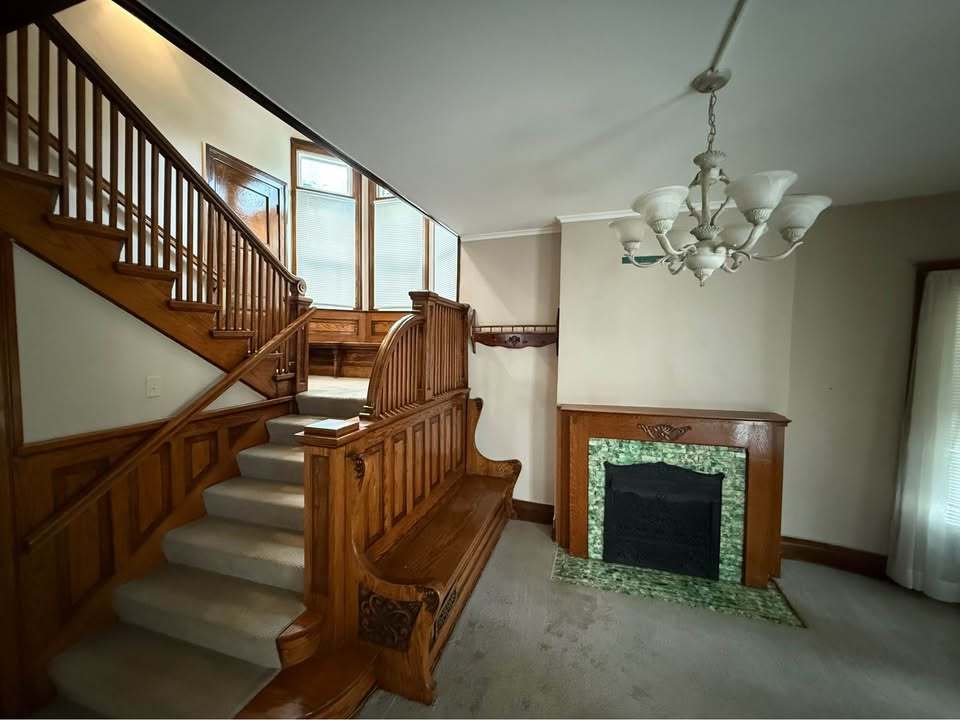 220 College Avenue, Unit 2 DeKalb, IL 60115 - Photo 3 of 14 a view of entryway and hall with wooden floor