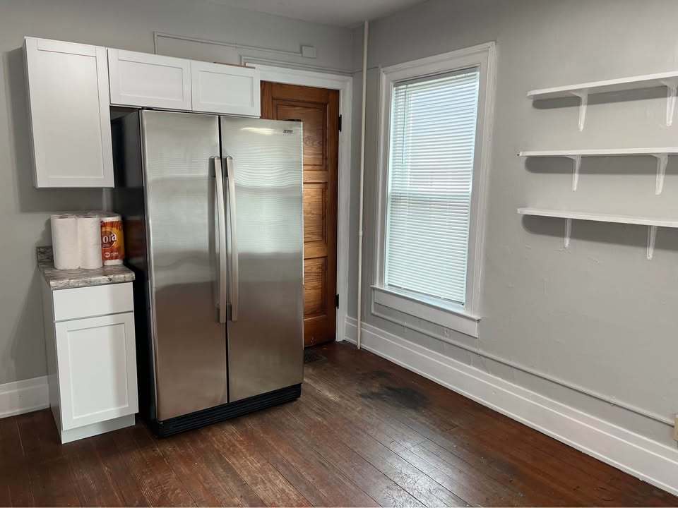 220 College Avenue, Unit 2 DeKalb, IL 60115 - Photo 6 of 14 a kitchen with stainless steel appliances a refrigerator and a window